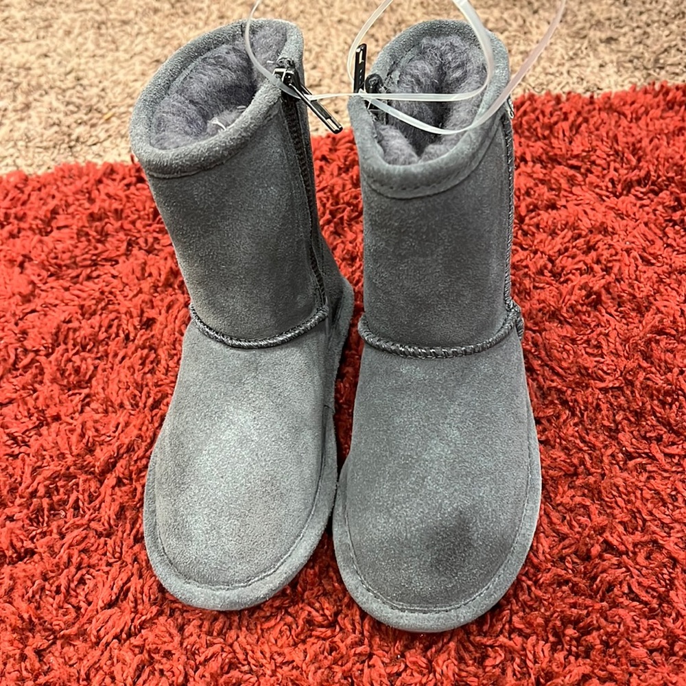 Bearpaw brands Boots NWOT never worn. Does have a spot on the left boot.